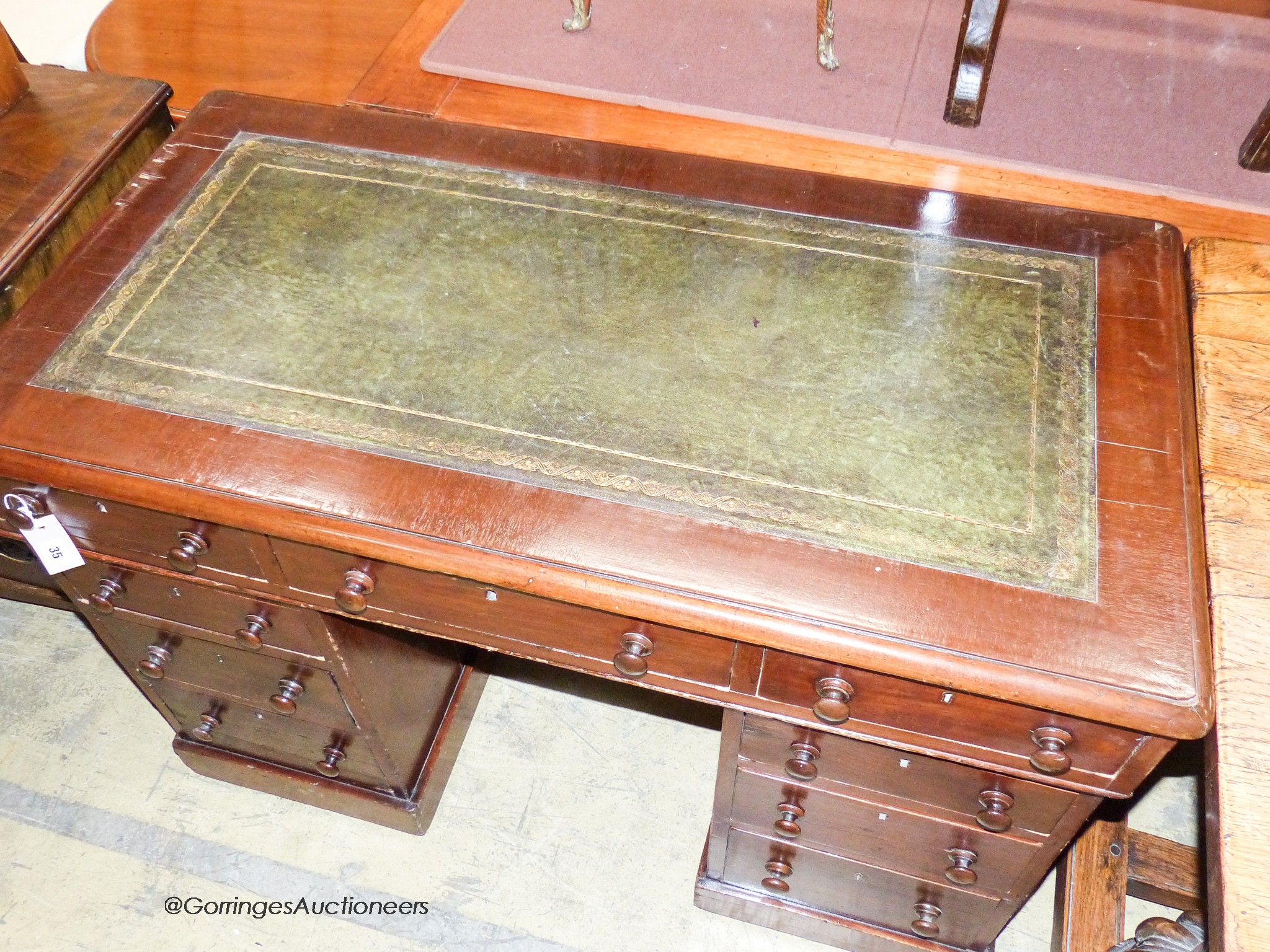 A Victorian mahogany pedestal desk, length 115cm, depth 61cm, height 79cm